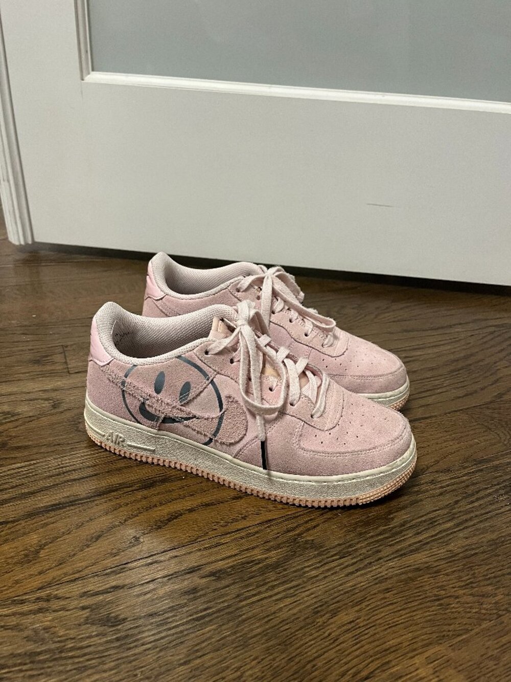 Pink Suede Nike Air Force 1 sneakers smiley face
